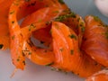 Smoked salmon with spices on a plate. Royalty Free Stock Photo