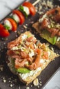 Smoked salmon toast with avocado. closed image