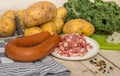 Smoked sausage and bacon with potatoes and kale Royalty Free Stock Photo