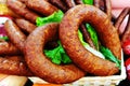 Smoked sausage in the form of a ring on the counter of the grocery store. Trade in meat products Royalty Free Stock Photo