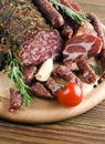 Smoked sausage with rosemary and peppercorns tomatoes and garlic Royalty Free Stock Photo