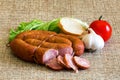 Smoked sausage with rustic food Royalty Free Stock Photo