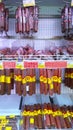 Smoked Sausage, salami, lunch meat products on supermarket shelves. Retail industry. Grocery store. Food price. Concept of
