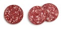 Smoked sausage salami slice isolated on white background with clipping path and full depth of field. Top view. Flat lay Royalty Free Stock Photo