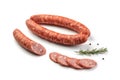 Smoked sausage salami with slices isolated on white background with herbal and pepper clipping path and full depth of field