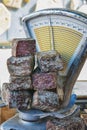 Smoked sausage on the scales on the market in Vallon Pont d`Arc, France.