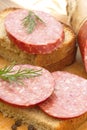 Smoked sausage with spices and greens for sandwiches Royalty Free Stock Photo