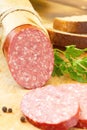 Smoked sausage with spices and greens for sandwiches Royalty Free Stock Photo