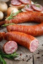 Smoked sausage on a wooden table.