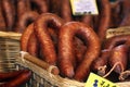 Smoked sausages in baskets with price tags Royalty Free Stock Photo