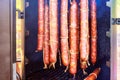 Smoked sausages meat hanging in smokehouse. Royalty Free Stock Photo