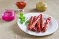 Smoked sausages, Mustard, horseradish and sauce on a plate Royalty Free Stock Photo