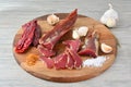 Smoked, sliced pork meat on dark wooden chopping board Royalty Free Stock Photo