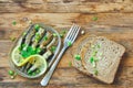 Smoked sprats in oil, fork, grain bread