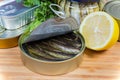 Smoked sprats in the open tin can close-up