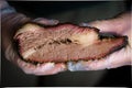 Smoked Texas brisket in chef`s hands