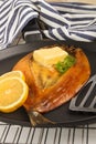 Smoked warm scottish kipper with butter Royalty Free Stock Photo