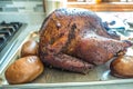 Smoked whole turkey and potatoes on a tray ready for lunch and dinner