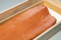 Smoked wild sockeye salmon inside wooden box close up