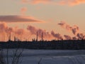 Smokestack Factory with black smoke over the sky with cloud when sunset time, industry and pollution concept Royalty Free Stock Photo