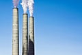 Smokestacks of a Coal Plant Polluting Concept against Clear Blue