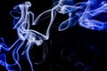 Smoke dancing in blue colours