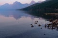 Smokey hazy view of Lake McDonald at sunset in Glacier National Park Royalty Free Stock Photo