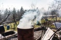 Smoking barrel in the middle of the garden Royalty Free Stock Photo