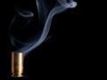 Smoking bullet casing Royalty Free Stock Photo