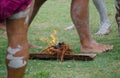 A `smoking ceremony` among Indigenous Australians that involves burning plants to produce smoke.