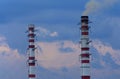 Smoking chimney tops on the winter sky background. Heating season. The view of chimneyÃ¢â¬â¢s tops