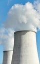 Smoking chimneys against the blue sky, environmental pollution concept Royalty Free Stock Photo