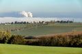 Smoking chimneys in from factory hidden in mist Royalty Free Stock Photo