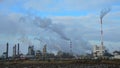Smoking chimneys and smoke stacks of large chemical factory during winter season. Location Duslo Sala, western Slovakia.