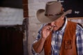 Smoking, cigar and senior cowboy on ranch for farming, agriculture and stable for rodeo animals. Western, countryside Royalty Free Stock Photo