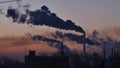 Smoking factory chimneys. Environmental problem of pollution of environment and air in large cities. View of large plant