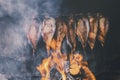 Smoking fish in a smokehouse.