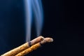 Smoking flavored sticks on a black background Royalty Free Stock Photo
