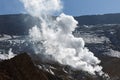 Smoking fumarole in crater of active volcano. Volcanic landscape