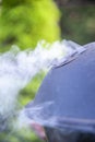 Smoking grill on the garden on a summer sunny day