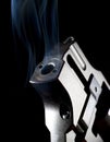 Smoking gun Royalty Free Stock Photo