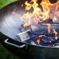 Smoking hot fire with fiery flames in a BBQ