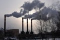 Smoking industrial chimneys in a city Royalty Free Stock Photo