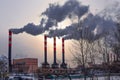 Smoking industrial chimneys in a city Royalty Free Stock Photo