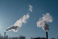 Smoking industrial chimneys. Smoking power plant. White smoke against sun. Air Pollution Royalty Free Stock Photo