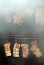 Smoking meat in the smokehouse