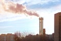 Smoking a pipe of heating plants supplying heat to the city and blue sky