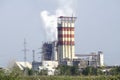 Smoking pipes of thermal power plant against blue sky Royalty Free Stock Photo