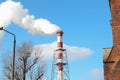 Smoking pipes of thermal power plant against blue sky Royalty Free Stock Photo