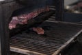 Smoking pork ribs in a large oven in a great pub.